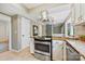 Modern kitchen featuring granite countertops, stainless steel appliances, and stylish lighting at 11700 Fernhurst Ln, Charlotte, NC 28277