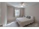 Comfortable bedroom with a large window and neutral decor at 121 Shagbark Ln, Mooresville, NC 28115