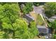 Aerial view of the property features a home surrounded by lush greenery, showcasing neighborhood at 12822 Diamond Dr, Pineville, NC 28134