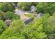 Aerial view of the property features a home surrounded by lush greenery, showcasing neighborhood at 12822 Diamond Dr, Pineville, NC 28134