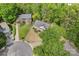 Aerial view of the property features a home surrounded by lush greenery, showcasing neighborhood at 12822 Diamond Dr, Pineville, NC 28134
