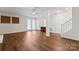 Spacious basement featuring hardwood floors, access to outside, and multiple doors for storage at 12822 Diamond Dr, Pineville, NC 28134