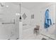 Clean bathroom featuring a soaking tub with glass shower, marble tile, and modern fixtures at 12822 Diamond Dr, Pineville, NC 28134