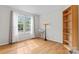 Inviting bedroom with hardwood floors, a large window, and ample natural light at 12822 Diamond Dr, Pineville, NC 28134