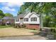 Charming home with a brick and vinyl exterior, black shutters and landscaped front yard and paved driveway at 12822 Diamond Dr, Pineville, NC 28134