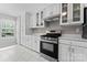 Kitchen showcasing stainless steel range, white cabinets and plenty of storage at 12822 Diamond Dr, Pineville, NC 28134