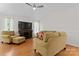 Cozy living room with hardwood floors, comfortable furniture, and natural lighting at 12822 Diamond Dr, Pineville, NC 28134