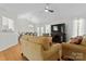 Bright living room with hardwood floors, tall ceilings, and a comfortable seating area at 12822 Diamond Dr, Pineville, NC 28134
