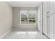 Sunlit room with tile flooring, bright windows, and built-in storage at 12822 Diamond Dr, Pineville, NC 28134
