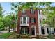 Charming brick townhome featuring a black door with decorative wreath, and black shutters at 12905 Bullock Greenway Blvd, Charlotte, NC 28277