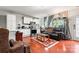 Open concept living area featuring white cabinets, hardwood floors, and cozy seating at 12905 Bullock Greenway Blvd, Charlotte, NC 28277
