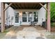 Covered patio with lots of natural light and ample space for outdoor relaxation or entertaining at 12905 Bullock Greenway Blvd, Charlotte, NC 28277