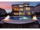 Backyard view featuring a sparkling pool with fire bowls, a covered patio, and an elevated screened in porch at 141 Forsythia Ln, Tega Cay, SC 29708