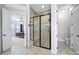 This luxurious bathroom features a walk-in shower with glass doors and a separate toilet room at 141 Forsythia Ln, Tega Cay, SC 29708