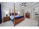 The luxurious bedroom features a four-poster bed, recessed lighting, and elegant decor at 141 Forsythia Ln, Tega Cay, SC 29708