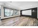 Versatile bonus room with wood-look floors, a blank whiteboard, and large windows that provide plenty of natural light at 141 Forsythia Ln, Tega Cay, SC 29708