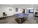 Well-lit game room with table tennis, bar stools, and framed wall decorations at 141 Forsythia Ln, Tega Cay, SC 29708
