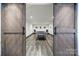 Spacious game room with barn doors and a table tennis table for recreation and entertainment at 141 Forsythia Ln, Tega Cay, SC 29708
