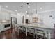 Modern kitchen featuring a large island with seating, stainless steel appliances, and custom cabinets at 141 Forsythia Ln, Tega Cay, SC 29708