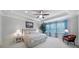 Relaxing bedroom featuring tray ceilings, recessed lighting, and many windows for natural light at 141 Forsythia Ln, Tega Cay, SC 29708