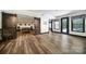 Open rec room features a table tennis, dark trim, barn doors, access to pool via patio doors, and natural light at 141 Forsythia Ln, Tega Cay, SC 29708