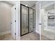 Modern shower with glass enclosure and decorative tile detail at 141 Forsythia Ln, Tega Cay, SC 29708