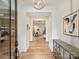 Bright foyer boasting hardwood floors, modern chandelier, and open archways at 1523 Saint George St, Charlotte, NC 28205