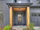 Inviting front entrance with wooden support beams and a glass-paneled front door at 1523 Saint George St, Charlotte, NC 28205
