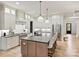 Modern kitchen with stainless steel appliances, a large island, and white cabinets at 1523 Saint George St, Charlotte, NC 28205