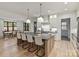 Open kitchen area view to dining area featuring a large kitchen island, and custom finishes at 1523 Saint George St, Charlotte, NC 28205