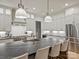 Bright kitchen featuring an oversized island with bar seating, custom cabinets, and stainless steel appliances at 1523 Saint George St, Charlotte, NC 28205