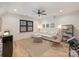 Bright living room features hardwood floors, recessed lights, ceiling fan, and natural light at 1523 Saint George St, Charlotte, NC 28205