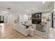 Spacious living room features a fireplace, built-in shelving, and hardwood floors at 1523 Saint George St, Charlotte, NC 28205