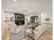 Bright living room features a fireplace with custom shelves and light hardwood floors at 1523 Saint George St, Charlotte, NC 28205