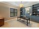 Elegant home office featuring custom shelving, modern lighting, and plantation shutters at 1523 Saint George St, Charlotte, NC 28205