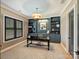 Stylish office with custom built-ins, decorative lighting, and a large window at 1523 Saint George St, Charlotte, NC 28205
