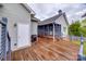 Exterior view of the back of the house with a spacious wooden deck, and a porch swing at 1545 Wimbleton Woods Dr, Fort Mill, SC 29708