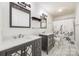 Modern bathroom featuring dual vanities, decorative mirrors, and a shower with a stylish curtain at 1545 Wimbleton Woods Dr, Fort Mill, SC 29708