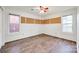 Bedroom featuring hardwood flooring, natural light, and custom corkboard decor at 1545 Wimbleton Woods Dr, Fort Mill, SC 29708
