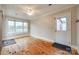 Bright room features hardwood floors, ceiling fan, and access to outdoor features at 1545 Wimbleton Woods Dr, Fort Mill, SC 29708