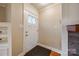 Bright foyer features a white door, hardwood floors, and neutral paint that complement a marble fireplace at 1545 Wimbleton Woods Dr, Fort Mill, SC 29708