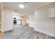 Open-concept layout with modern kitchen, stainless appliances, and seamless flow to dining and living areas at 1545 Wimbleton Woods Dr, Fort Mill, SC 29708