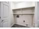 Convenient laundry room offers ample storage with built-in shelving and modern fixtures at 1545 Wimbleton Woods Dr, Fort Mill, SC 29708