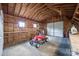 Interior of the shed featuring a garage door and a riding lawn mower at 1545 Wimbleton Woods Dr, Fort Mill, SC 29708
