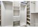 Organized walk-in closet with built-in shelves, drawers, and ample hanging space at 1545 Wimbleton Woods Dr, Fort Mill, SC 29708