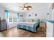 Cozy main bedroom features a ceiling fan, wood flooring and windows at 1756 Martin Rd, Kings Mountain, NC 28086