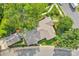Aerial view showcasing the home's roof and landscaping within a lush, green neighborhood at 1801 Wilmore Dr, Charlotte, NC 28203