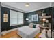 Cozy bedroom with stylish decor, hardwood floors, and natural light at 1801 Wilmore Dr, Charlotte, NC 28203