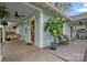 Charming front porch with a swing, potted plants, and stylish outdoor seating, offering a welcoming curb appeal at 1801 Wilmore Dr, Charlotte, NC 28203