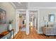 Hallway featuring hardwood floors and detailed trim at 1801 Wilmore Dr, Charlotte, NC 28203